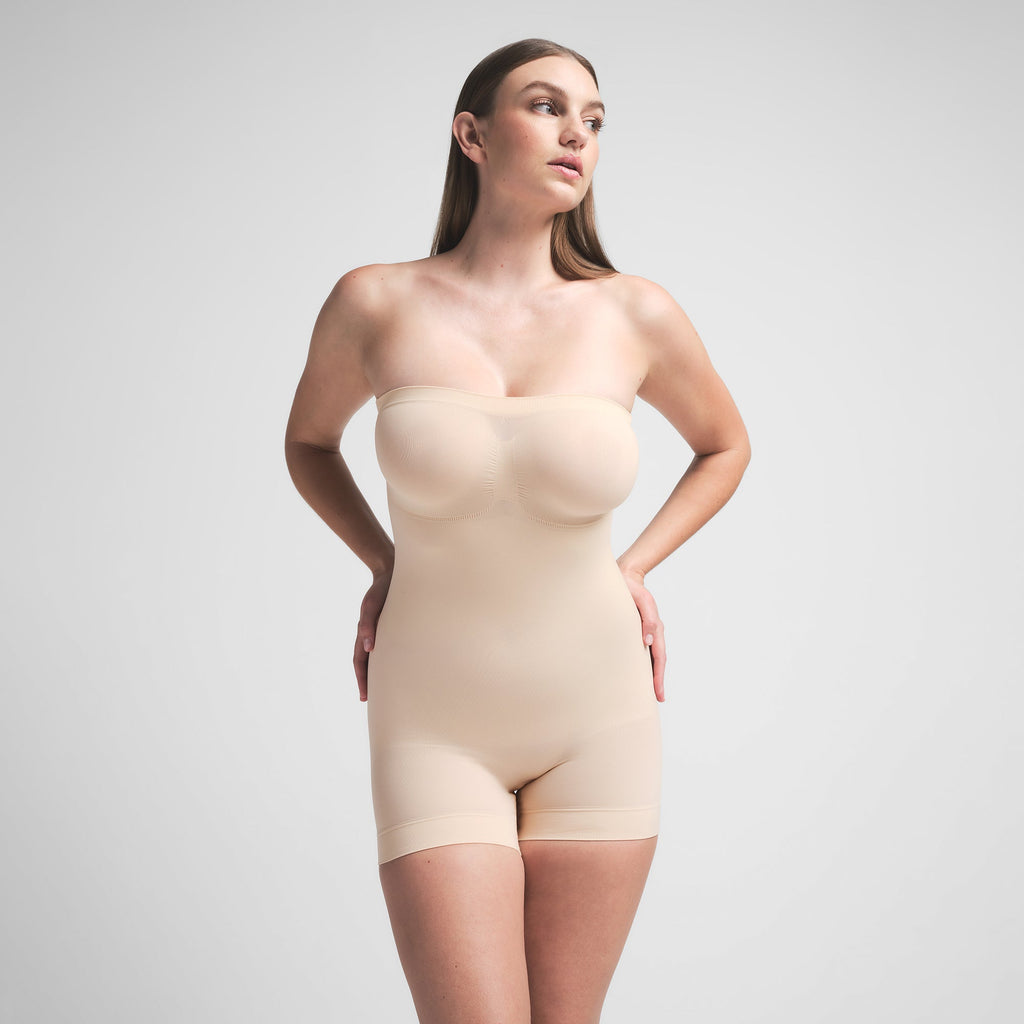 SEAMLESS SCULPT STRAPLESS SHORTIE BODYSUIT | SAND