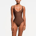 SKIMS BODY CORE SCULPT PLUNGE THONG BODYSUIT | JASPER