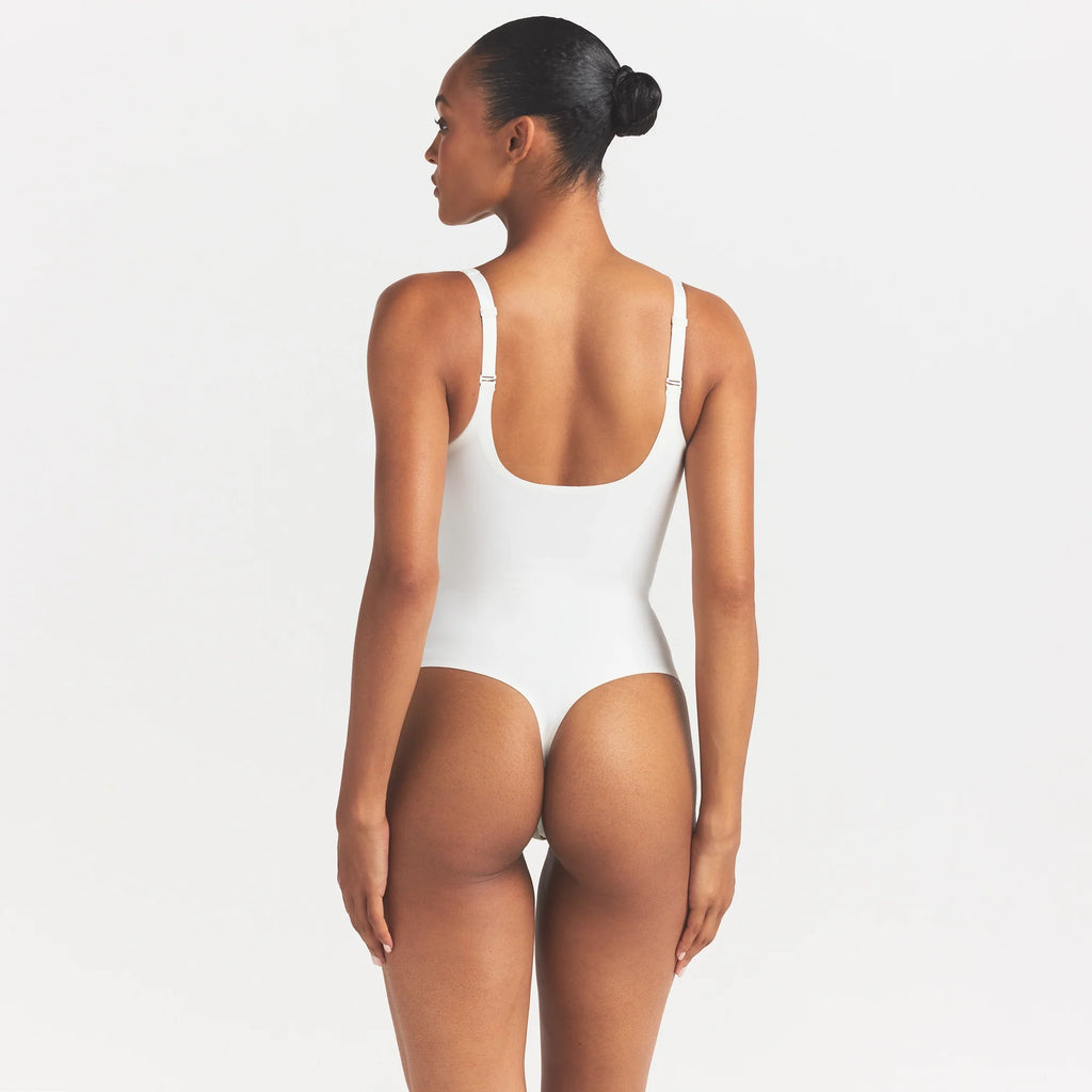 SKIMS BODY UNLINED PLUNGE THONG BODYSUIT | IVORY