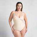 SKIMS BODY UNLINED PLUNGE THONG BODYSUIT | SAND