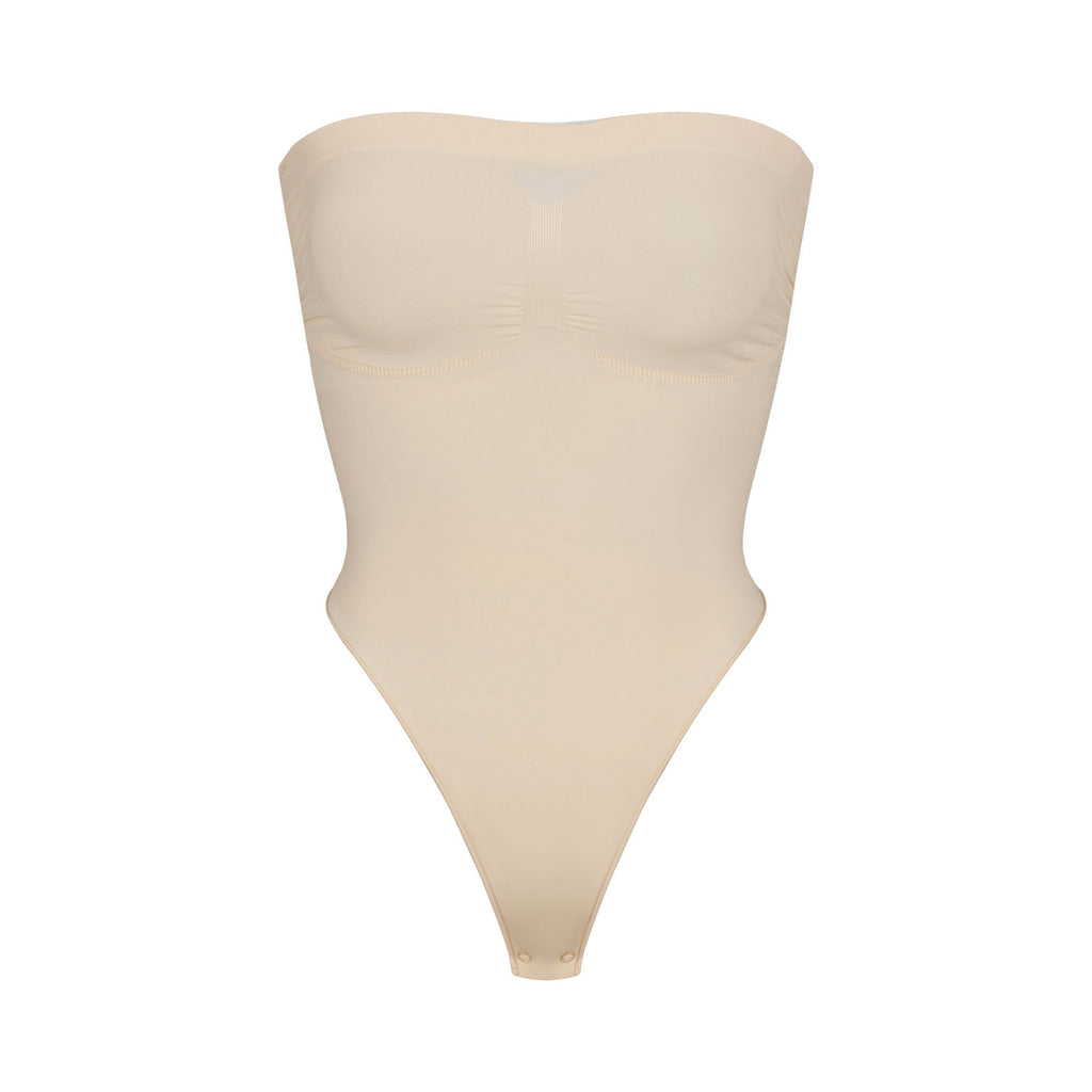 SEAMLESS SCULPT STRAPLESS THONG BODYSUIT | SAND